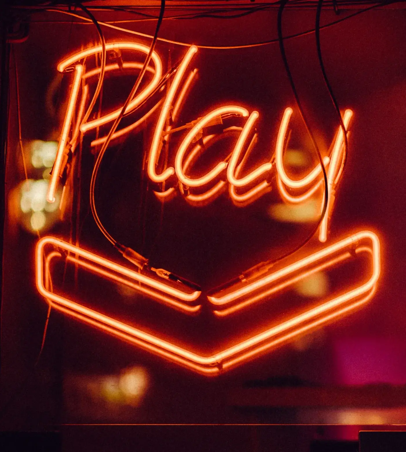 A neon sign reading Play
